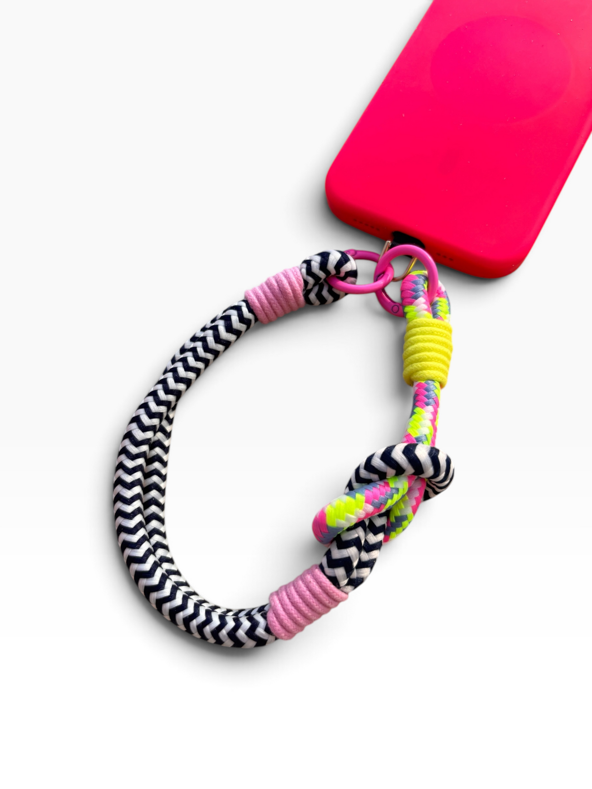 LEY! „LUJA“ Handykette: Neon-Hülle mit robustem Seil-Handyband, Farben: Schwarz, Weiß, Pink und Gelb.