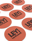 Mehrere runde, rötlich-orangefarbene LEY! STICKER mit fetten schwarzen "LEY! Ley it! Love it!"-Schriftzug sind auf einer weißen Fläche verteilt, perfekt für persönliches Branding wie einzigartige Logo-Aufkleber.